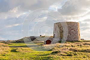 British Lewis Tower with nazi bunker in the background, Saint Quen, bailiwick of Jersey, Channel Islands photo
