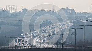 British motorway in a rush hours, in a foggy afternoon