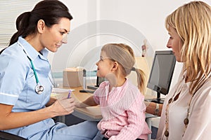 British nurse about to inject young child photo