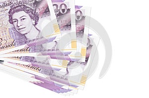 20 British pounds bills lies in small bunch or pack isolated on white. Mockup with copy space. Business and currency exchange