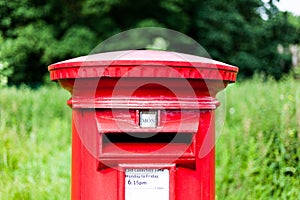 British red mailbox for gathering mail. Traditional mail gathering mailbox.