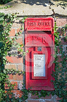 British Red Postbox set in wall