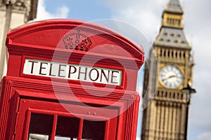 British red telephone box with Big Ben clock tower, London, UK