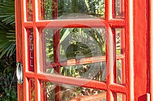 British red telephone box door in close up.