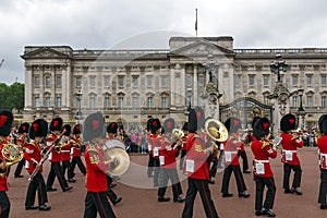 British Royal guards perform the Changing of the Guard in Buckingham Palace, London, England, Gre