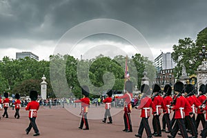 British Royal guards perform the Changing of the Guard in Buckingham Palace, London, England, Gre