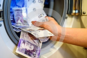 British Sterling Pounds Notes Taken Out of Washing Machine. Money Laundering Concept