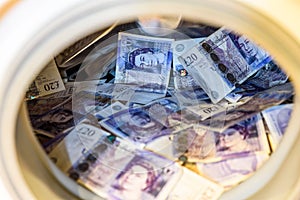 British Sterling Pounds Notes In Washing Machine. Money Laundering Concept