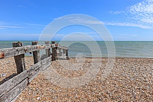 British stoney beach and wooden groyne.