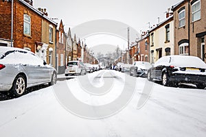 British street under winter snow fall in england uk