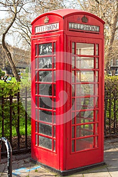 British Telecoms telephone box near a park in London