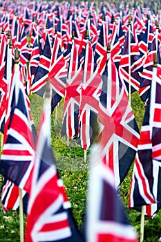 British United Kingdom UK Flags in a row with front focus and the further away symbols blurry with bokeh. The flags were set up on