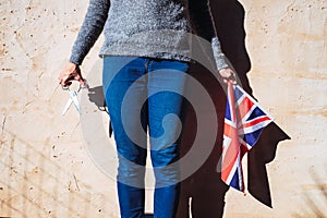 British woman angry with her English politicians denies her nationality by cutting British flag