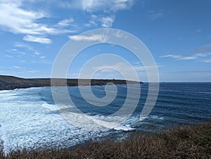 Brittany Beach: Waves Crashing on Shore, Clear Sky