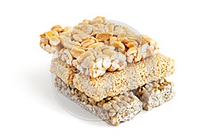 Brittle bars made of peanut and sesame seeds isolated on white