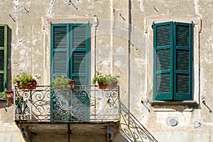 BRIVIO, ITALY/ EUROPE - SEPTEMBER 18: Shuttered Windows on a Building in Brivio Lombardy Italy on September 18, 2015