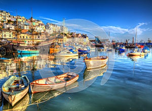 Brixham boats Devon England UK English harbour with brilliant blue sky