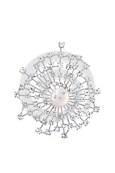 Broach with pearl and brilliants on a white background