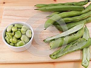 Broad beans being podded
