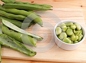 Broad beans being podded