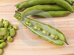 Broad beans being podded