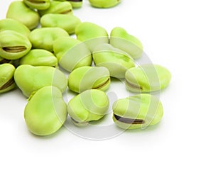Broad beans isolated on white photo