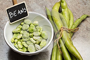 Broad beans in a white bowl
