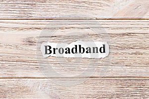 Broadband of the word on paper. concept. Words of Broadband on a wooden background