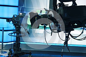 Broadcast television studio camera and crane camera in news studio room