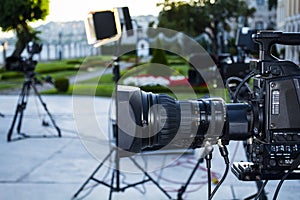 Broadcast tv; movie shooting camera or video production and film, tv crew team with camera