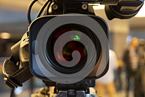 Broadcast video camera camcorder back in the studio TV show. Broadcasting, producers.