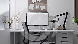 Broadcasting or live-streaming home office studio interior with modern pc computer, microphone