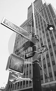 Broadway and Fulton Street signs on a traffic light post, New York City, USA