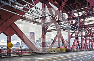 Broadway metal drawbridge over Willamette River overlooking Portland down town