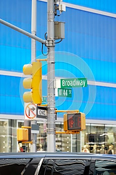 Broadway road sign and traffic light at the Times Square, New York City, selective focus, USA