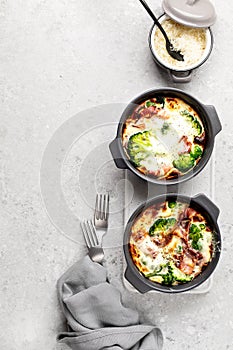 Broccoli, bacon Cheese Bake on a gray stone background