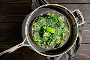 Broccoli Florets on a Steamer Basket Placed in a Saute Pan