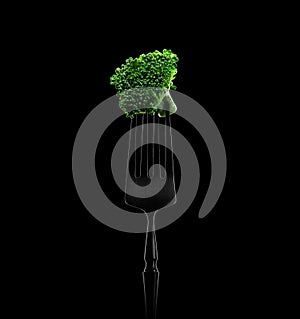 Broccoli on a fork. Black background