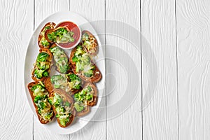 Broccoli melts vegan sandwiches on a plate