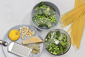 Broccoli pasta. Green peas, mint and broccoli in blender and in bowl