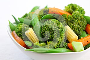 Broccoli salad with carrot ,baby corn and snap pea photo