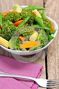 Broccoli salad with carrot ,baby corn and snap pea photo