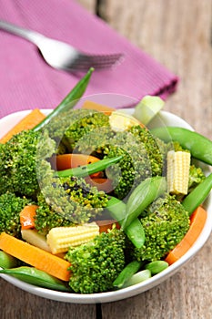 Broccoli salad with carrot ,baby corn and snap pea photo