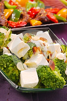 Broccoli salad with feta and flaked almonds photo