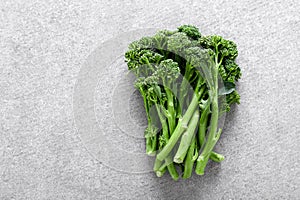 Broccolini. Fresh bunch of broccoli sprouts on a cooking table. Healthy food concept