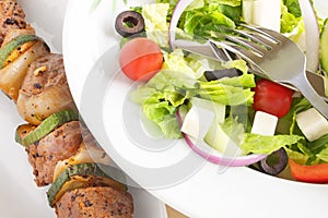 Brochette with Greek salad