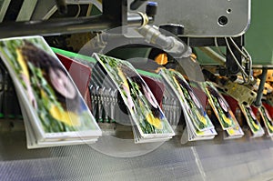 Brochure and magazine stitching process. photo