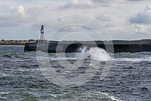 Brock Harbour Lighthouse on a stormy day, Fraserburgh, Aberdeenshire,Scotland,UK. photo