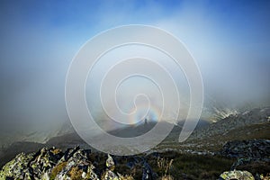 Brocken spectra in the mountains photo