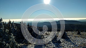 Brocken steam locomotice running up Hill winter blue sky